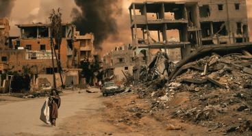 Walking in destroyed city, a little girl seeks shelter