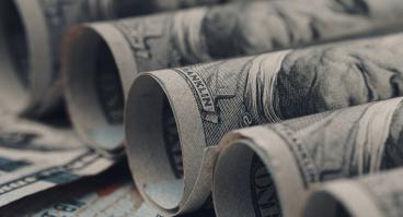 American US dollar bills rolled