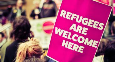 Refugees are welcome here protest sign
