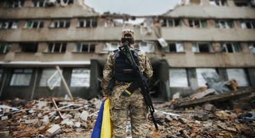 Ukrainian military woman with the Ukrainian flag 