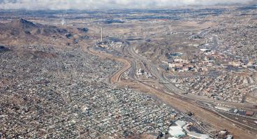The Rio Grande River, that runs down the center of this photo, marks the US-Mexico Border