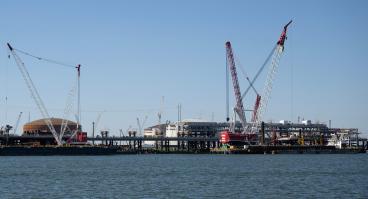 Construction cranes are seen near the construction site of the Venture Global LNG plant in Plaquemines Parish south of New Orleans, Louisiana on October 17, 2023.