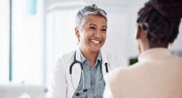 Doctor consulting a patient in meeting