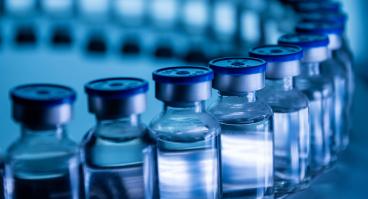 Group of Vaccine bottles. Medicine in ampoules. Glass vials for liquid samples in laboratory.