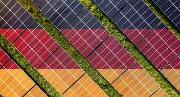 Solar farm superimposed with flag of Germany. Symbolizing solar power and panel demand, renewable energy industry, government policy, and sustainability initiatives in the country.