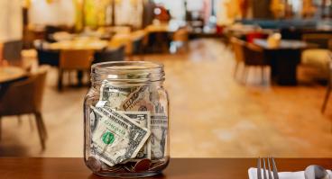 Tip jar in restaurant dining room