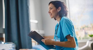 Head nurse fills medical history form
