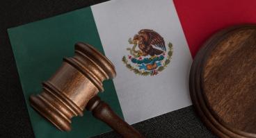 Judge gavel on flag of Mexico. Mexican legislation. 