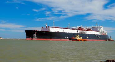 PORT ARANSAS, TX - 22 FEB 2020: The FLEX RANGER, a blue LNG Tanker Ship, on the shipping channel between the Gulf of Mexico and Corpus Christi, Texas