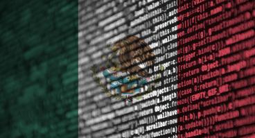 Digital code overlaid over Mexican flag