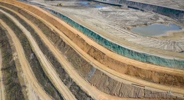  Aerial view of industrial terraces on mineral open pit mine.