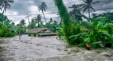 Rising water levels submerging a house as heavy monsoon rains cause major floods in Baco, Oriental Mindoro, Philippines on July 23, 2021.