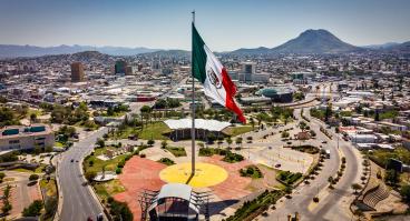 Panoramic view of Chihuahua with Mexican flag