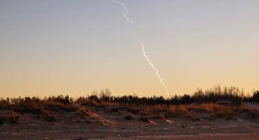 Missile trail in sky