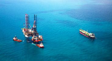 Oil rigs sitting in the ocean