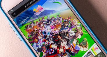 image of anime game on a mobile phone