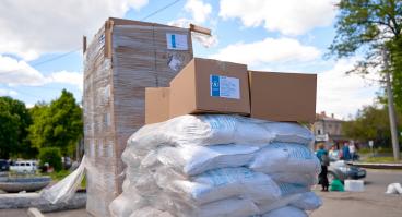 Humanitarian food aid unloaded in front of humanitarian center.