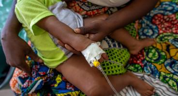 Child receiving treatment at health center at NGO in Dapaong, Togo.