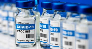COVID-19 vaccine, vaccination bottles in a line.