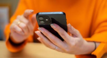 Person scrolling through cellphone