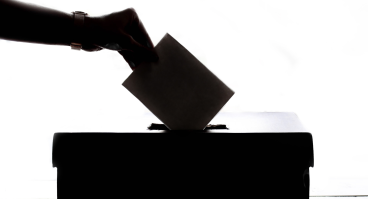 Person dropping off ballot