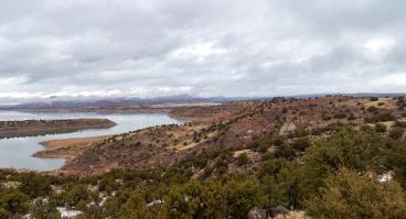 Red rocks around a reservoir