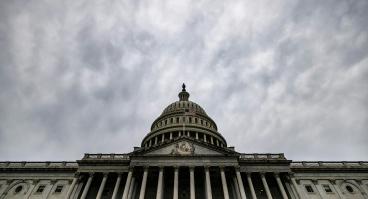 U.S. Capitol with grey sky above