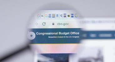 magnifying glass image of CBO website