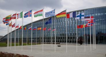 The national flags of countries member of the NATO fly outside the organisation headquarters in Brussels, Belgium on April 20 2023.