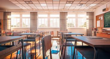high school classroom with desks/tables and chairs