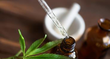 Macro close up of droplet dosing a biological and ecological hemp