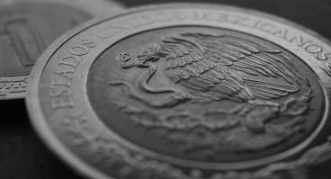Coin of 5 Mexican pesos close-up. Peso of Mexico. Reverse of coin with coat of arms of country. 