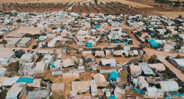 Aerial view of hundreds of tents inhabited by Syrian refugees for years due to the war that destroyed their homes.