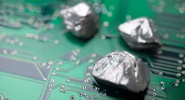 rare mineral rocks on green circuit board