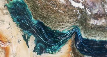 Satellite view of the Persian Gulf and Strait of Hormuz with glowing blue lines symbolizing naval traffic and strategic maritime routes amidst geopolitical tensions and regional conflict in Iran.