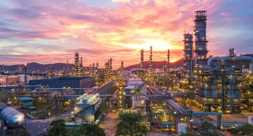 oil refinery at sunset