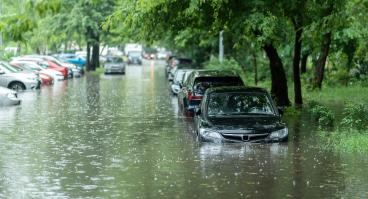 Flooded cars on the street of the city.