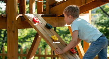 Child at play on colorful playground equipment