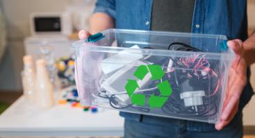 An electronic waste in recycling container close-up.
