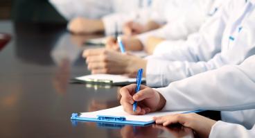 Medical workers working in conference room.