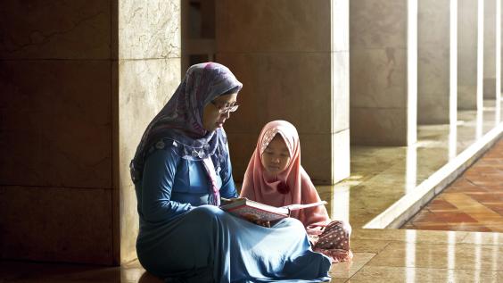 Mother and daughter reading book