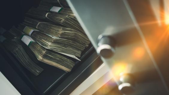 Money sits in a bank safe.
