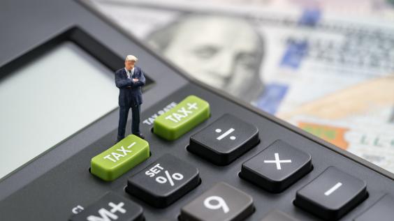 Calculator atop dollar bills