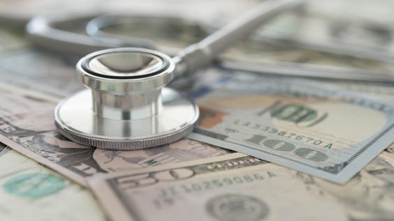 A stethoscope on American paper currency.