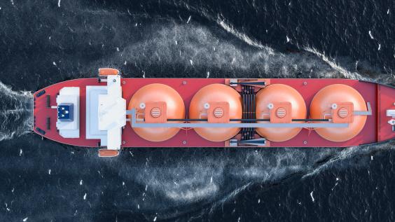 A gas tanker moves through a body of water.