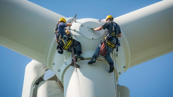 Engineers working on a wind turbine