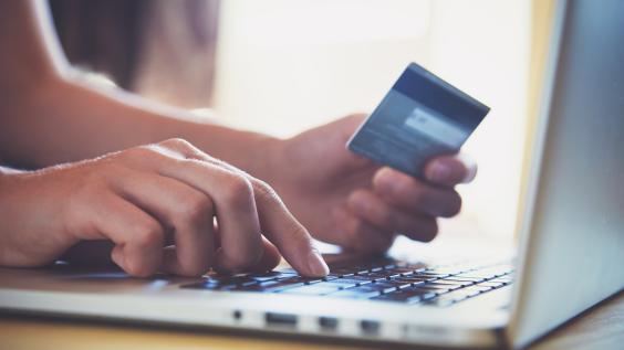 Credit card being used for online shopping