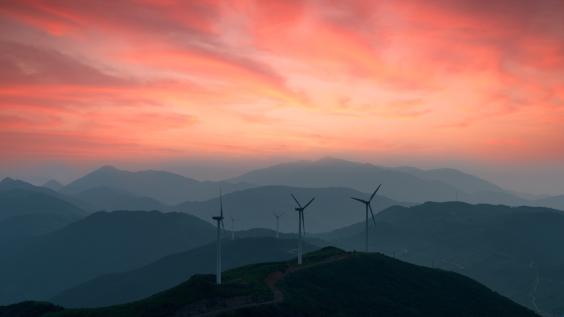 Windmills in front of a sunset
