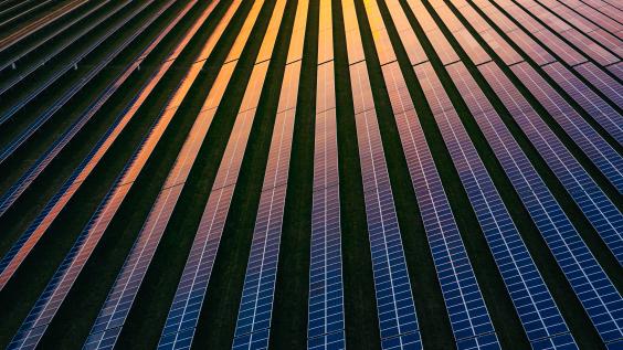 This photo shows an aerial view of solar panels.