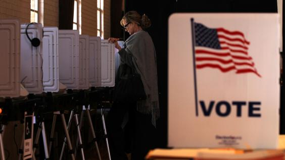Woman casting her vote at the polls.